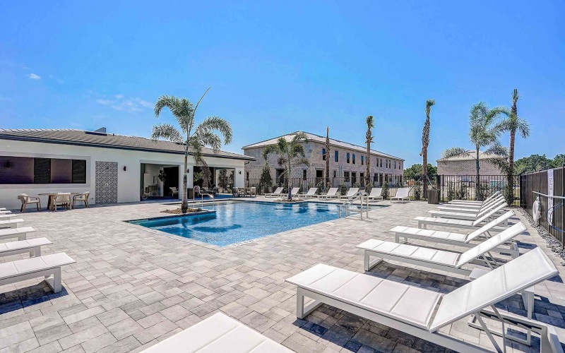 lounge chairs around pool