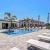 lounge chairs around pool